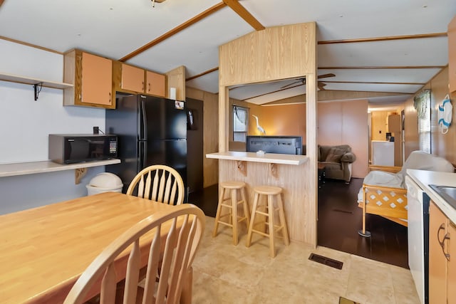 14 Scarlets Way, Bronston, KY 42518 - kitchen featuring black appliances, lofted ceiling, light countertops, and a kitchen bar