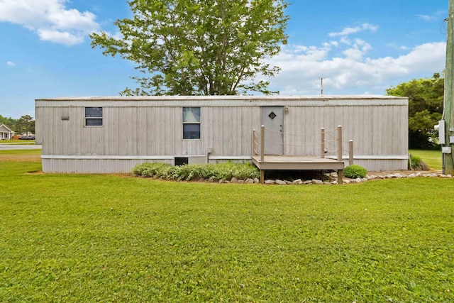 14 Scarlets Way, Bronston, KY 42518 - rear view of house featuring a lawn