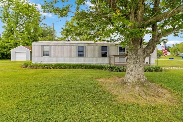14 Scarlets Way, Bronston, KY 42518 - manufactured / mobile home with a detached garage, a front lawn, and an outdoor structure