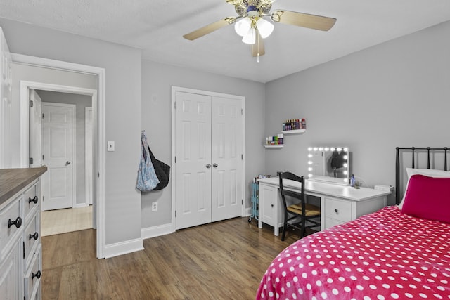 3648 Cottage Cir, Lexington, KY 40513 - bedroom with wood finished floors, a closet, baseboards, and a ceiling fan