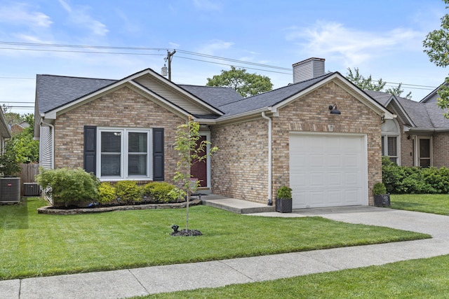 3648 Cottage Cir, Lexington, KY 40513 - view of front of house with a garage, concrete driveway, a front yard, and a shingled roof