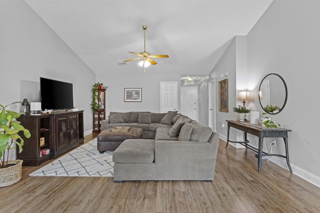 3648 Cottage Cir, Lexington, KY 40513 - living room featuring ceiling fan, wood finished floors, baseboards, and high vaulted ceiling
