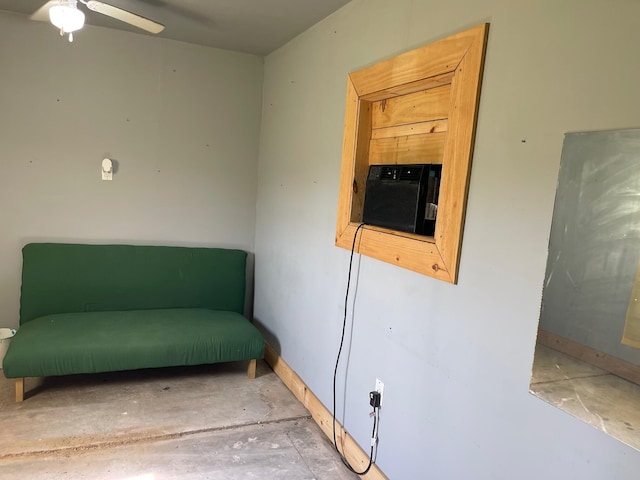 600 S 38th St, Middlesboro, KY 40965 - living area with concrete flooring and a ceiling fan