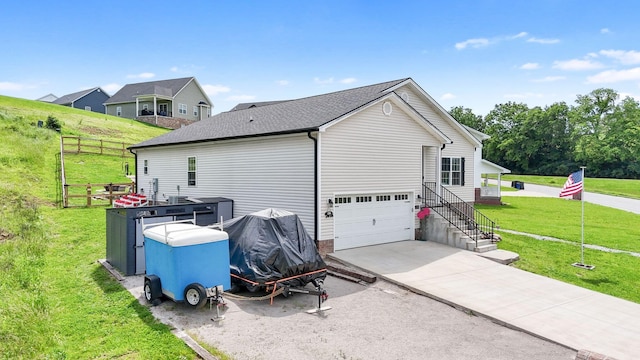 116 Hackberry Ct, Frankfort, KY 40601 - view of home's exterior with a yard, driveway, and an attached garage