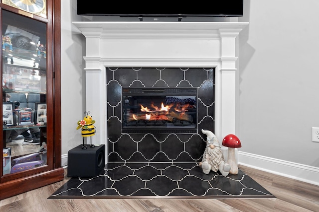 116 Hackberry Ct, Frankfort, KY 40601 - detailed view of a fireplace with flush hearth, wood finished floors, and baseboards