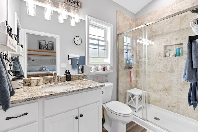 116 Hackberry Ct, Frankfort, KY 40601 - ensuite bathroom with vanity, a shower stall, toilet, lofted ceiling, and wood finished floors