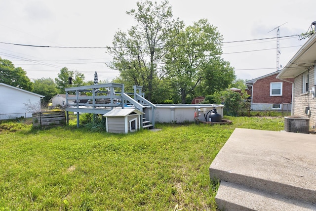 1818 Marlboro Dr, Lexington, KY 40505 - view of yard with a deck, an outdoor pool, and central AC