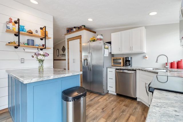460 Keller Ln, Science Hill, KY 42553 - kitchen featuring appliances with stainless steel finishes, a sink, light wood-type flooring, white cabinets, and recessed lighting