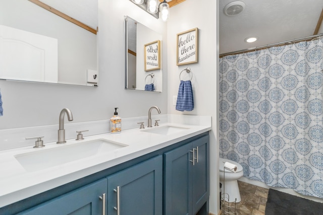 460 Keller Ln, Science Hill, KY 42553 - bathroom with double vanity, toilet, recessed lighting, curtained shower, and stone finish floors
