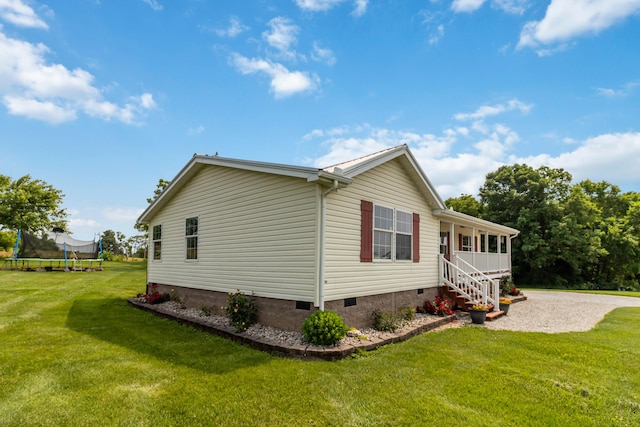 460 Keller Ln, Science Hill, KY 42553 - view of property exterior with crawl space, a trampoline, a yard, and a porch