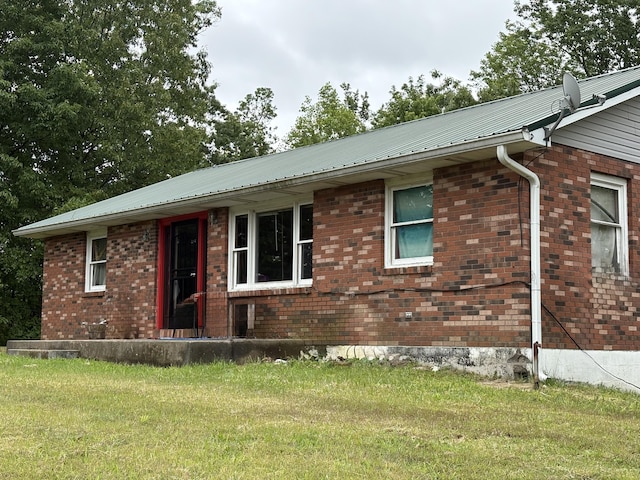 2671 Ky 1036, Zachariah, KY 41301 - view of front of home featuring a front lawn, brick siding, and metal roof