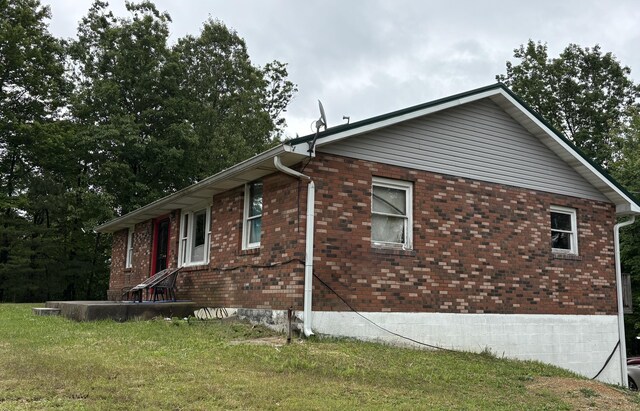2671 Ky 1036, Zachariah, KY 41301 - view of side of property with brick siding and a lawn