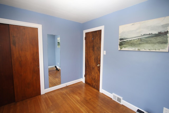 937 Mason Headley Rd, Lexington, KY 40504 - unfurnished bedroom with wood finished floors, baseboards, and a closet