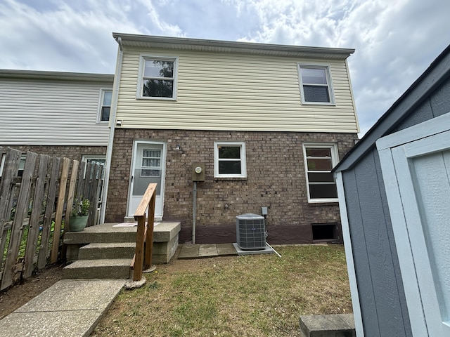281 Osage Ct, Lexington, KY 40509 - rear view of property with central AC unit and brick siding