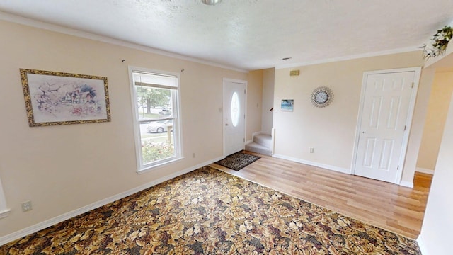 281 Osage Ct, Lexington, KY 40509 - foyer with wood finished floors, crown molding, and baseboards