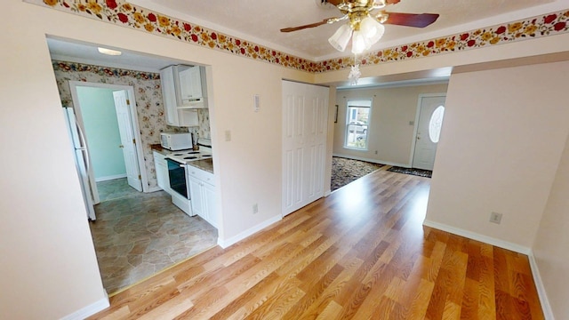 281 Osage Ct, Lexington, KY 40509 - kitchen featuring white appliances, white cabinetry, ceiling fan, and light wood-style flooring