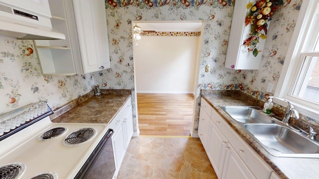 281 Osage Ct, Lexington, KY 40509 - kitchen featuring white range with electric cooktop, under cabinet range hood, wallpapered walls, a sink, and white cabinetry