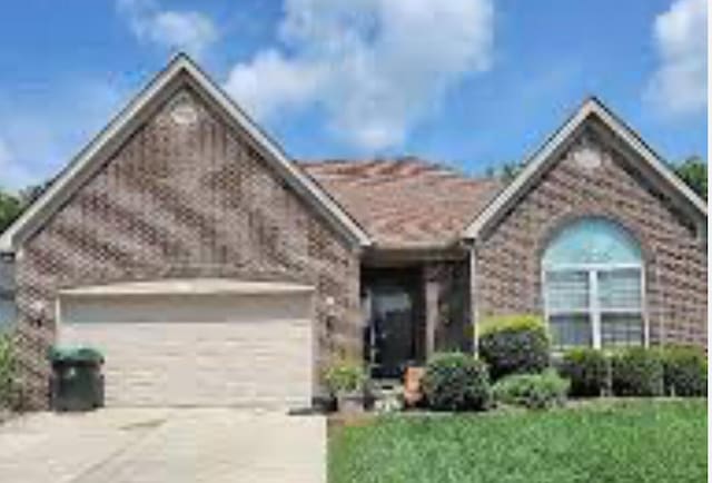133 W Mcintosh Park, Georgetown, KY 40324 - single story home featuring a garage, concrete driveway, and brick siding