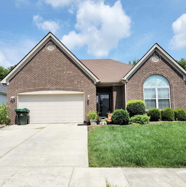 133 Mcintosh Park, Georgetown, KY 40324 - ranch-style house with brick siding, concrete driveway, a garage, and a front yard