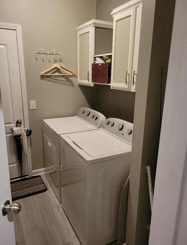 133 W Mcintosh Park, Georgetown, KY 40324 - washroom with separate washer and dryer, cabinet space, and wood finished floors
