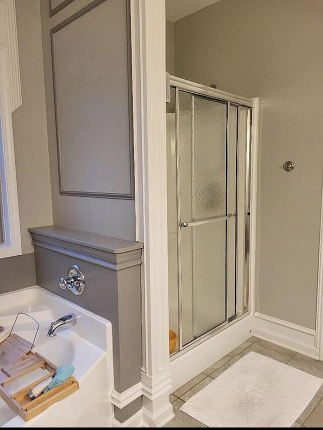 133 W Mcintosh Park, Georgetown, KY 40324 - full bath featuring a stall shower, a bath, tile patterned floors, and baseboards