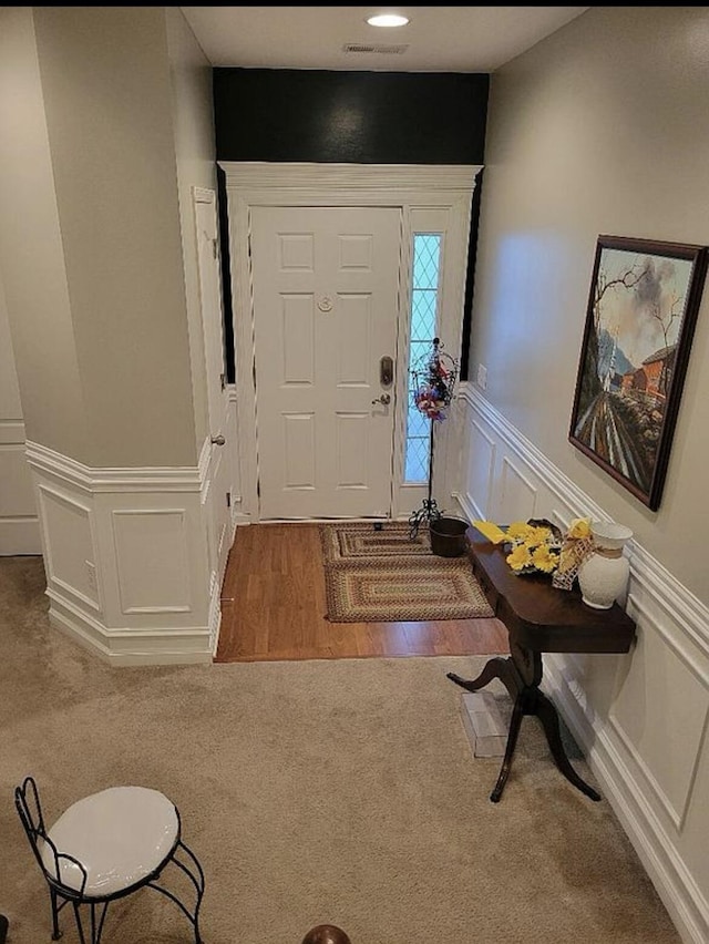 133 W Mcintosh Park, Georgetown, KY 40324 - carpeted entryway featuring a decorative wall and wainscoting
