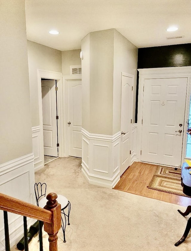 133 Mcintosh Park, Georgetown, KY 40324 - entrance foyer with light carpet, wainscoting, and a decorative wall