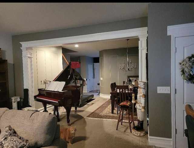 133 W Mcintosh Park, Georgetown, KY 40324 - sitting room featuring a chandelier, light carpet, decorative columns, and recessed lighting