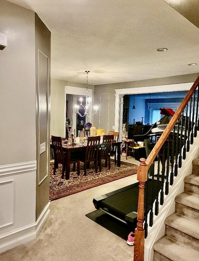 133 Mcintosh Park, Georgetown, KY 40324 - carpeted dining area featuring stairway and a chandelier