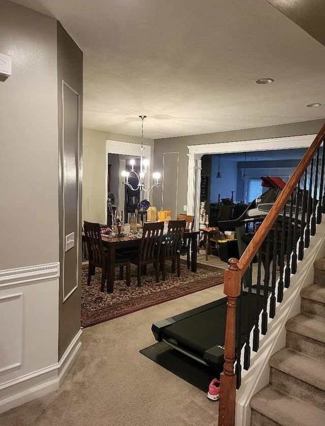 133 W Mcintosh Park, Georgetown, KY 40324 - dining area with carpet, stairs, and a chandelier