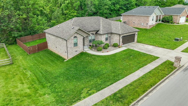 140 Central Park Ave, Berea, KY 40403 - view of front facade featuring brick siding, concrete driveway, a garage, and a shingled roof