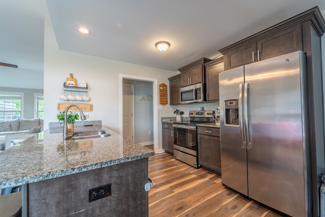 140 Central Park Ave, Berea, KY 40403 - kitchen with stainless steel appliances, dark brown cabinets, a sink, dark wood-type flooring, and stone countertops