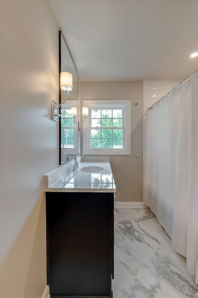 235 Westover Rd, Frankfort, KY 40601 - full bathroom featuring vanity, marble look tiles, and baseboards
