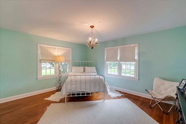 235 Westover Rd, Frankfort, KY 40601 - bedroom featuring multiple windows, baseboards, a chandelier, and wood finished floors