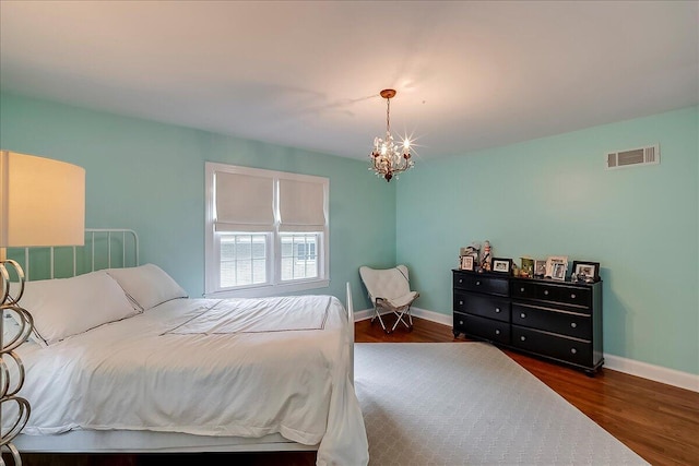 235 Westover Rd, Frankfort, KY 40601 - bedroom featuring a chandelier, baseboards, and wood finished floors