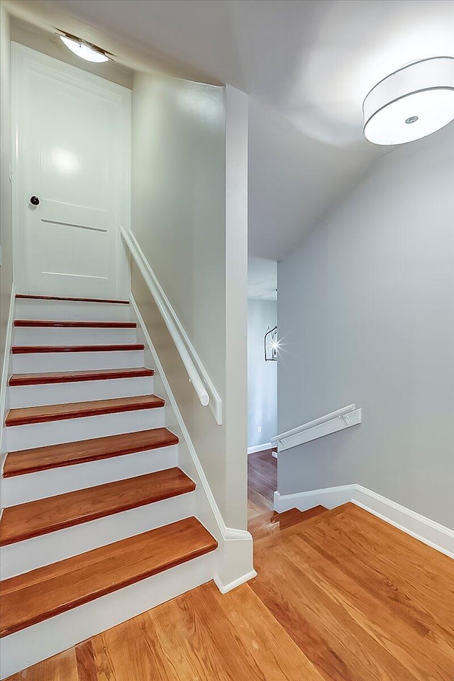 235 Westover Rd, Frankfort, KY 40601 - stairway featuring baseboards, wood finished floors, and vaulted ceiling