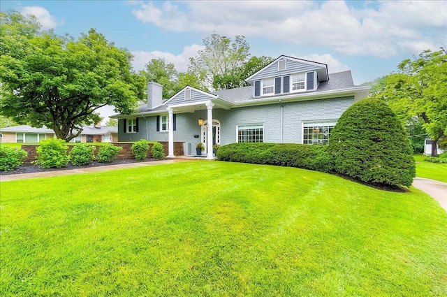 235 Westover Rd, Frankfort, KY 40601 - view of front of home featuring a front yard, a chimney, and brick siding