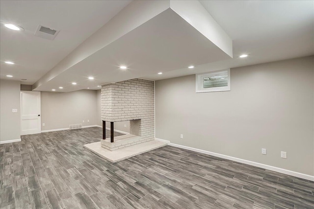 235 Westover Rd, Frankfort, KY 40601 - finished basement featuring wood finished floors, baseboards, a fireplace, and recessed lighting