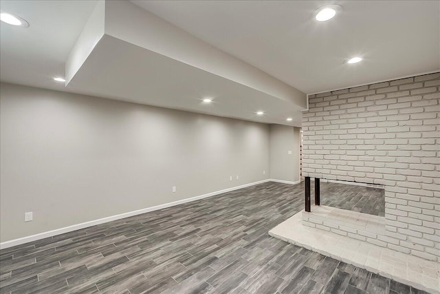 235 Westover Rd, Frankfort, KY 40601 - finished below grade area featuring dark wood finished floors, recessed lighting, baseboards, and a brick fireplace
