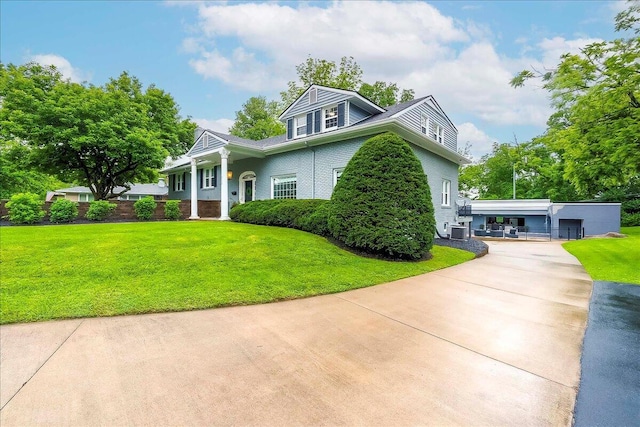 235 Westover Rd, Frankfort, KY 40601 - view of front of home featuring driveway, a front lawn, and central AC