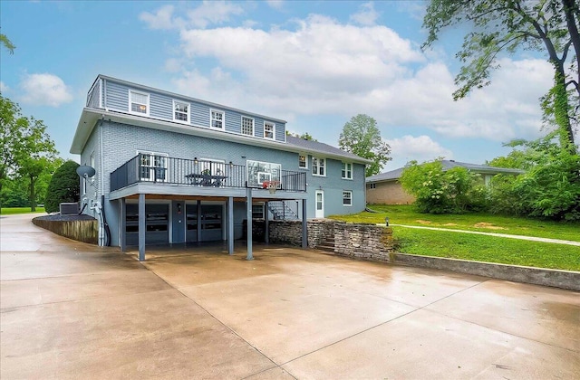 235 Westover Rd, Frankfort, KY 40601 - view of front facade with driveway, a front yard, stairway, a wooden deck, and a carport