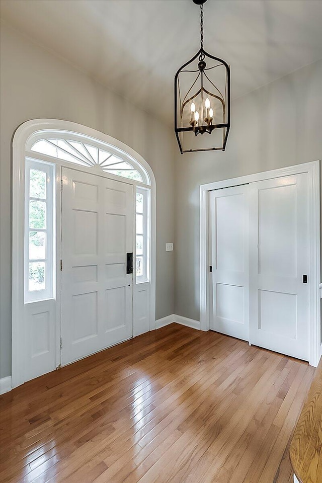 235 Westover Rd, Frankfort, KY 40601 - entryway featuring a chandelier, light wood-style floors, healthy amount of natural light, and baseboards