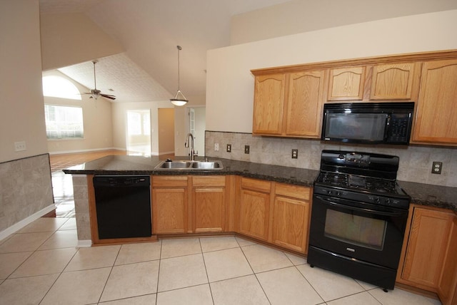 102 Academy Dr, Wilmore, KY 40390 - kitchen featuring black appliances, a sink, a peninsula, vaulted ceiling, and open floor plan