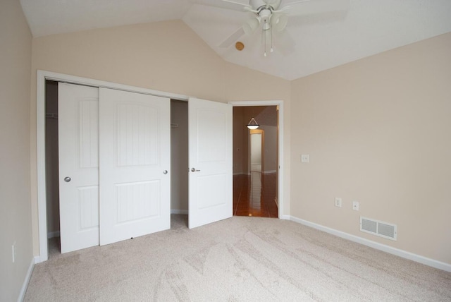 102 Academy Dr, Wilmore, KY 40390 - unfurnished bedroom featuring light carpet, vaulted ceiling, a closet, baseboards, and a ceiling fan