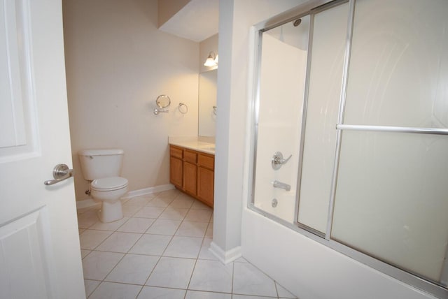 102 Academy Dr, Wilmore, KY 40390 - full bath featuring tile patterned floors, vanity, toilet, combined bath / shower with glass door, and baseboards