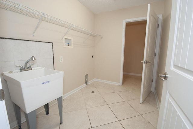 102 Academy Dr, Wilmore, KY 40390 - laundry room with washer hookup, electric dryer hookup, baseboards, and light tile patterned flooring