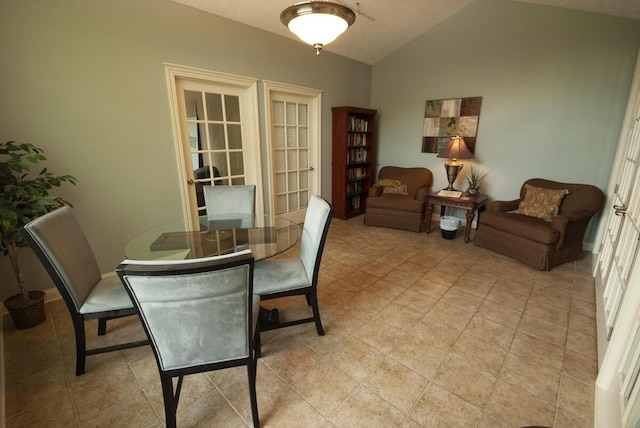 102 Academy Dr, Wilmore, KY 40390 - dining room with lofted ceiling, light tile patterned floors, and baseboards