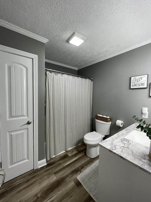 310 Yorktown Dr, Paris, KY 40361 - bathroom with ornamental molding, vanity, toilet, wood finished floors, and a textured ceiling