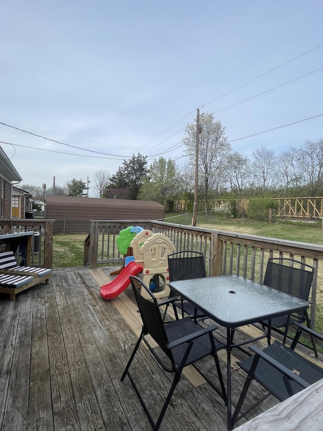 310 Yorktown Dr, Paris, KY 40361 - wooden deck featuring outdoor dining space and a lawn