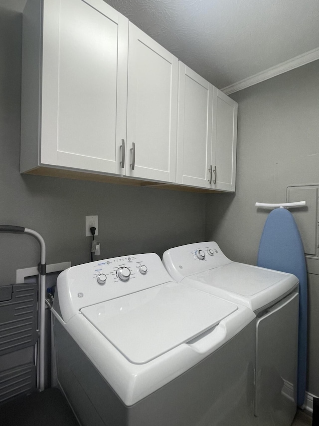 310 Yorktown Dr, Paris, KY 40361 - laundry area with cabinet space, independent washer and dryer, and ornamental molding